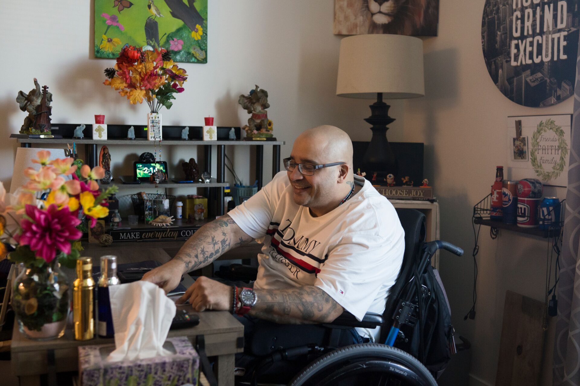 Jose Vega in his apartment, at his desk.